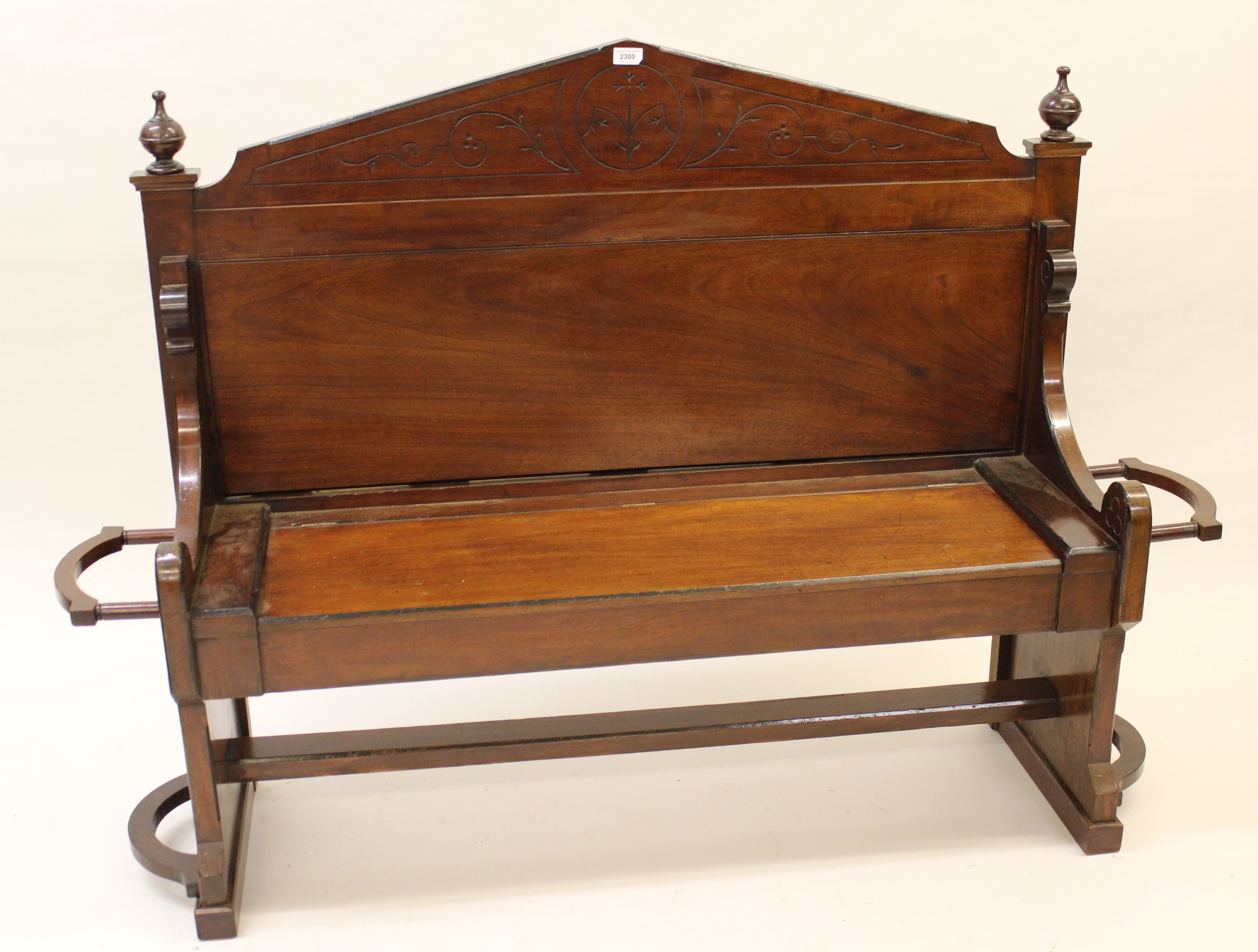 Victorian mahogany hall bench, the box seat with hinged cover having opposing stickstands to