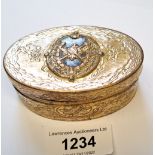19th Century oval gilt metal snuff box with cast decoration, 80mm wide