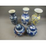 Two Chinese ginger jars with covers and three various Chinese baluster form vases Some damages as