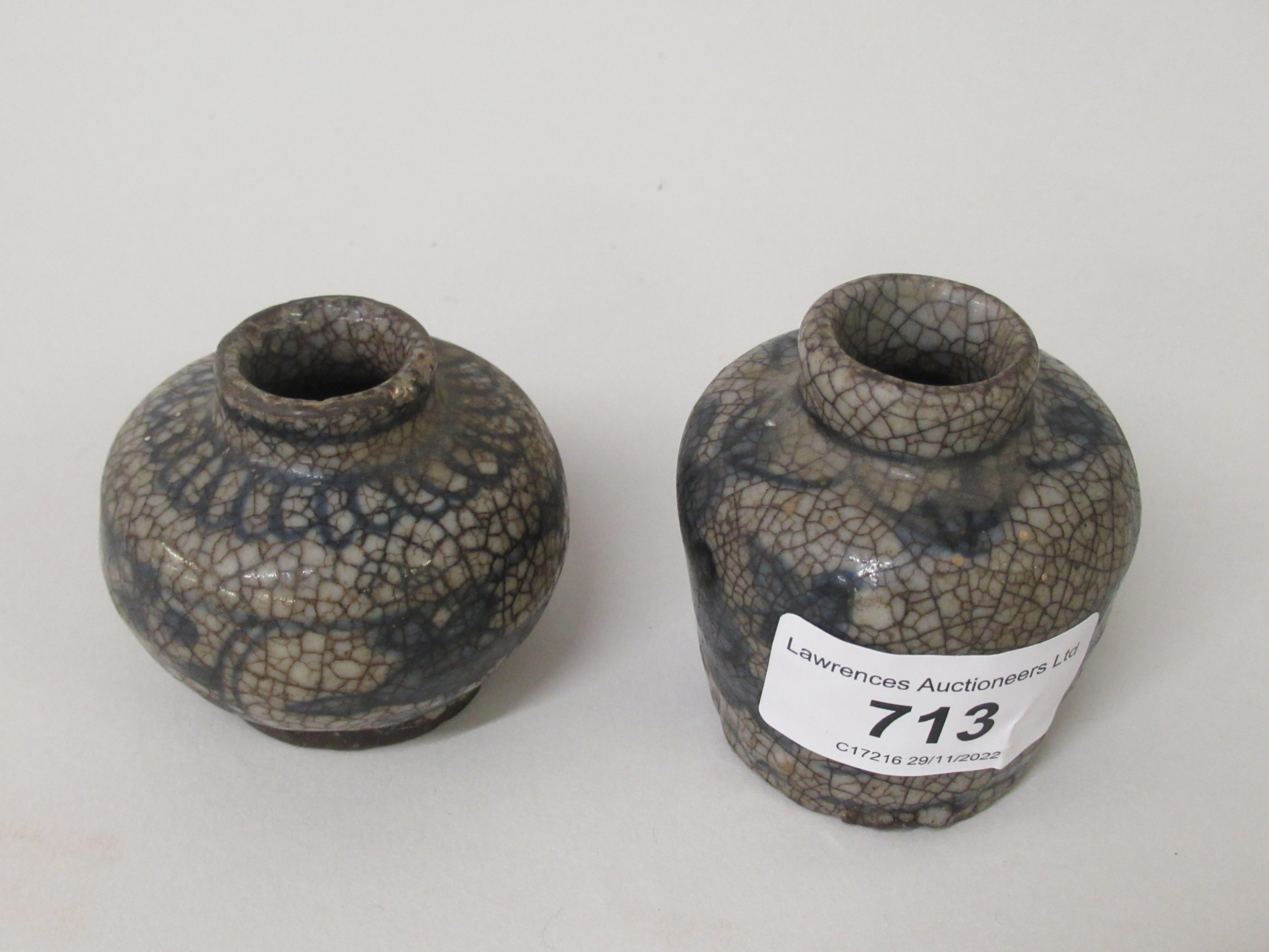 Two small Chinese miniature crackleware vases, decorated in blue, 2.25ins high each