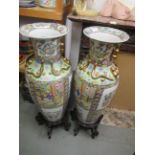 Pair of large reproduction Chinese baluster form vases, 36.5ins high with hardwood stands