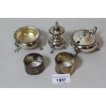 Birmingham silver three piece condiment set, together with two silver napkin rings