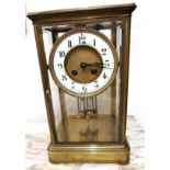 Early 20th Century gilt brass cased four glass library clock, the circular dial with white chapter