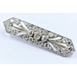 Unmarked high carat white metal and diamond set Art Deco bar brooch, 39mm wide