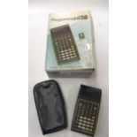 TI-58 Programmable calculator in original box, including original charger, instruction book and