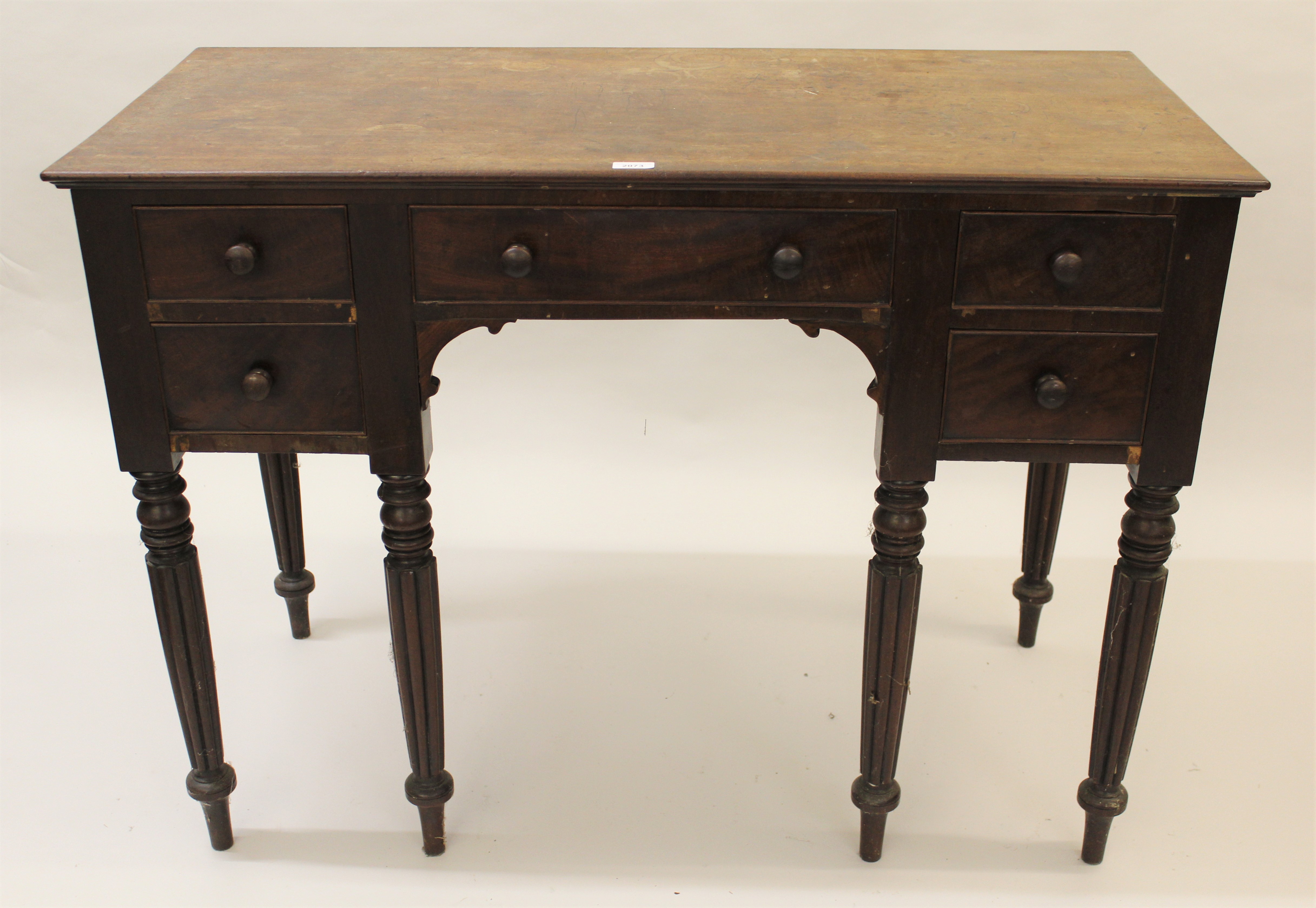 William IV mahogany dressing table, the plain top above five drawers with knob handles surrounding a