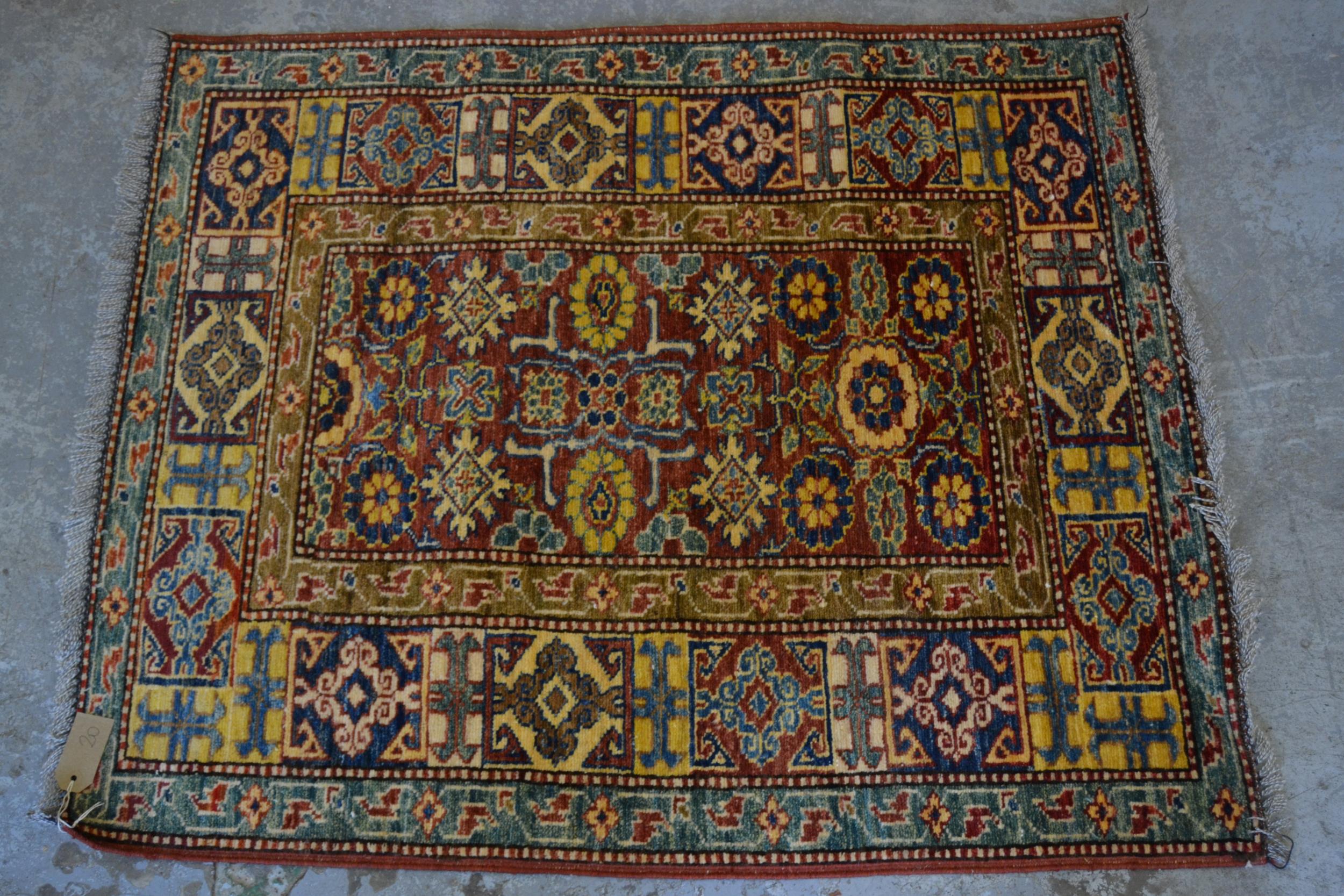 Small Kazak pattern rug of floral and multiple border design, 3ft 6ins x 2ft 6ins approximately