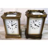 20th Century shaped gilt brass cased carriage clock with enamel dial, having Roman numerals and