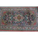 Small modern Persian silk rug with a lobed medallion and all-over stylised floral and bird design,