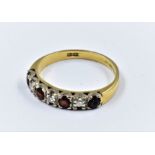 18ct Gold ring set four rubies and three diamonds, size 'L'