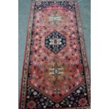 Modern Persian rug of Qashqai design with a triple medallion and all-over floral pattern on a rose