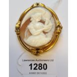 19th Century yellow metal mounted cameo brooch, carved with a scene depicting a female figure,