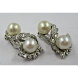 Pair of 14ct white gold cultured pearl and diamond set clip earrings of stylised floral design,