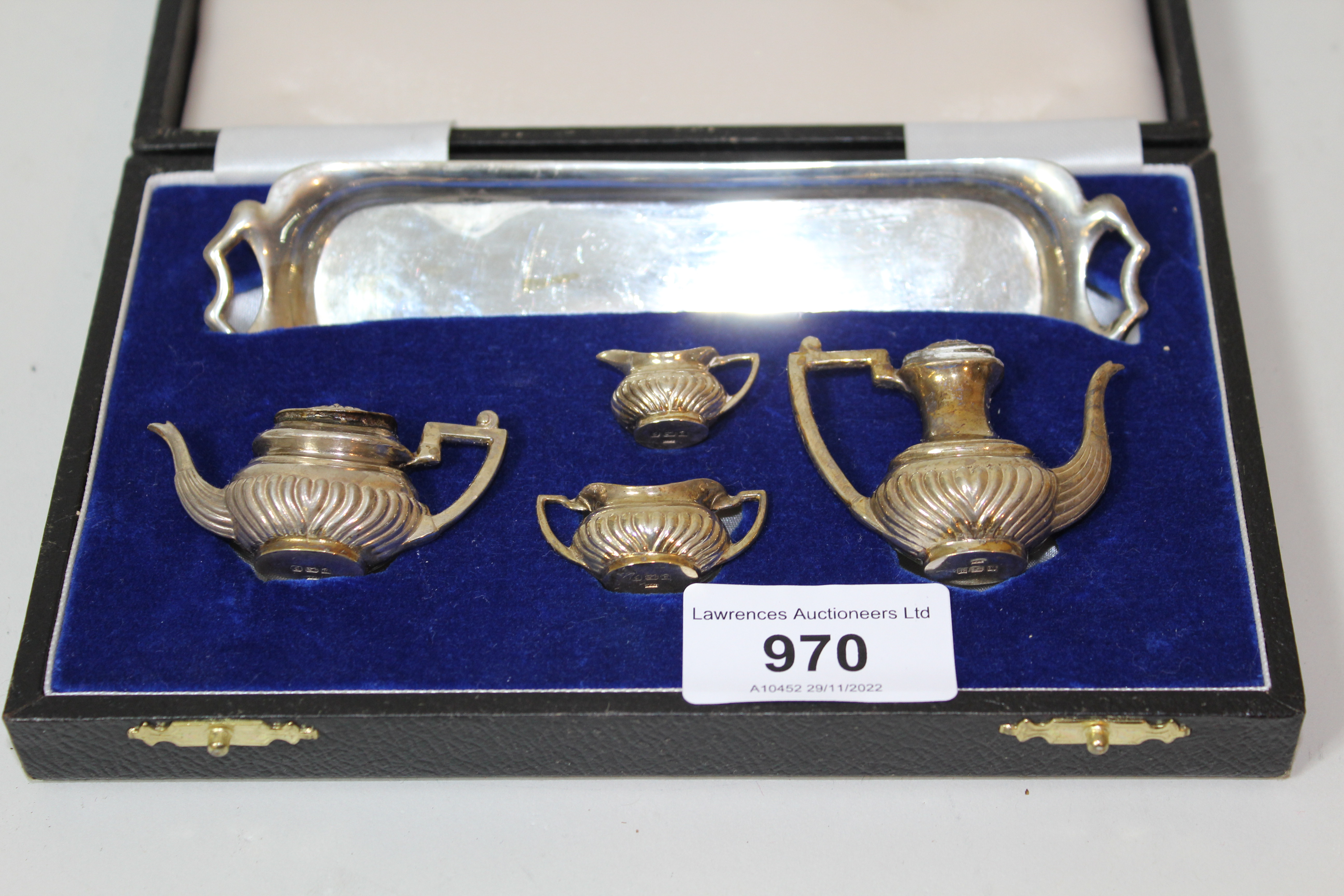 Miniature Birmingham silver four piece teaset on tray in fitted box