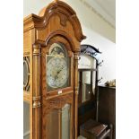 Modern reproduction light oak longcase clock with moonphase dial, signed Howard Miller, the three