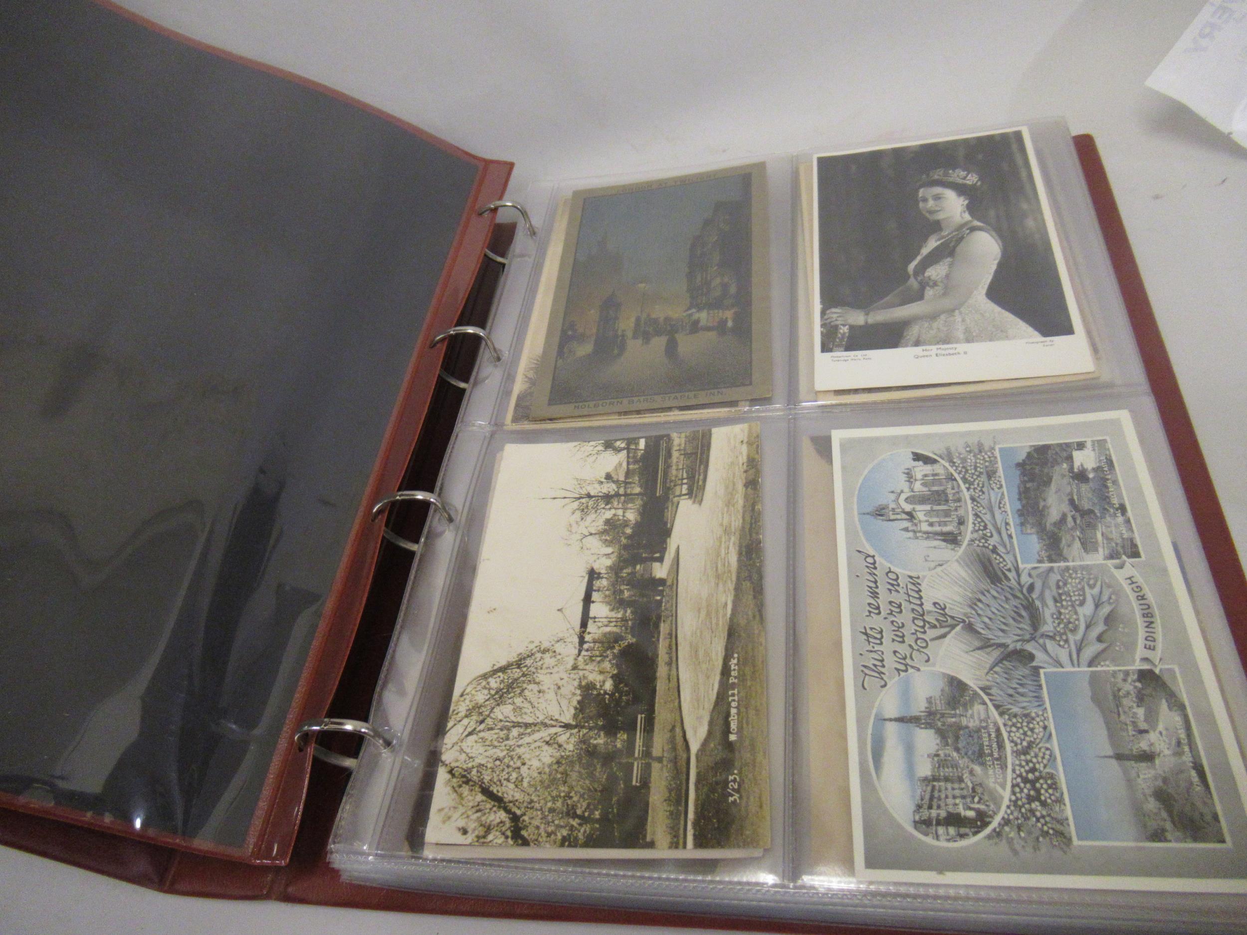 Album containing a quantity of various mainly early 20th Century postcards