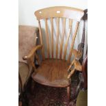 Early 20th Century stickback kitchen elbow chair with elm seat on turned supports
