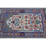 Isfahan wool and silk prayer rug with a Mihrab bird and floral design on an ivory ground with corner
