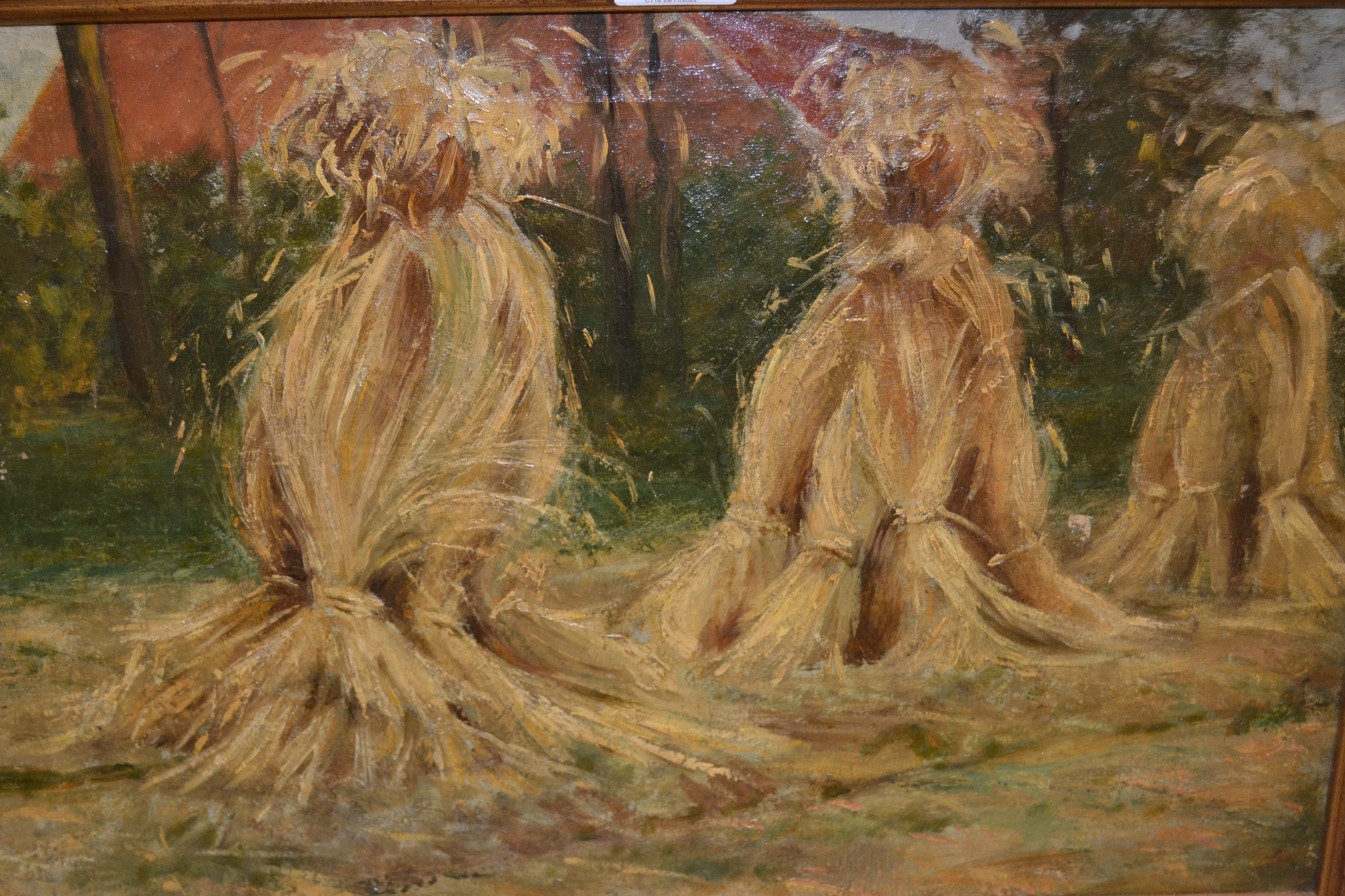 Early 20th Century oil on canvas, landscape with corn stooks, signed and inscribed verso, 13ins x