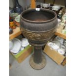 Dark patinated and gilded terracotta jardinière and stand, 36ins high approximately