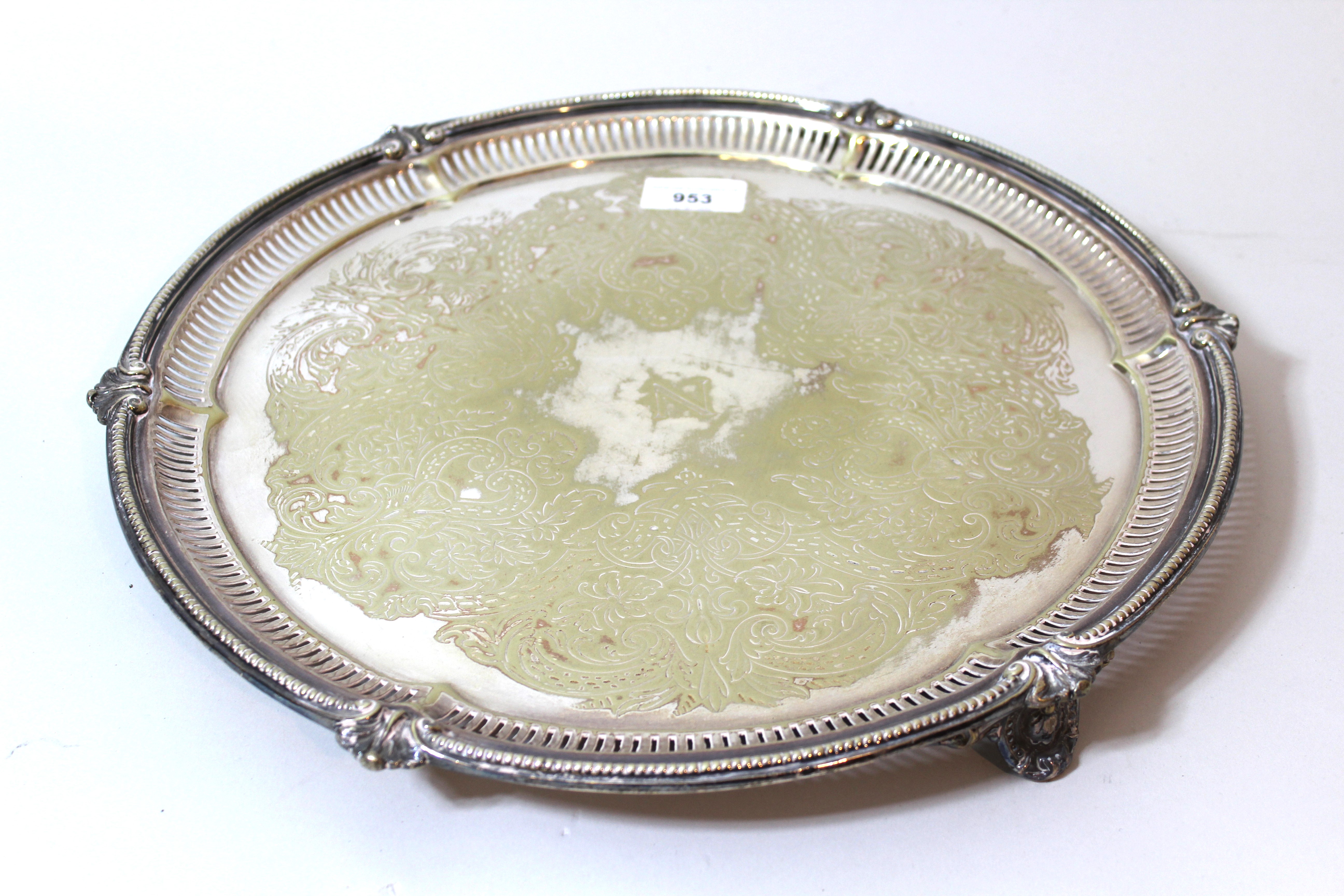 Silver plated circular floral engraved and pierced salver (plating worn)