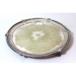 Silver plated circular floral engraved and pierced salver (plating worn)