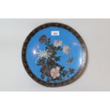 Japanese circular cloisonne wall plate, decorated with a butterfly and flowers, 12ins diameter