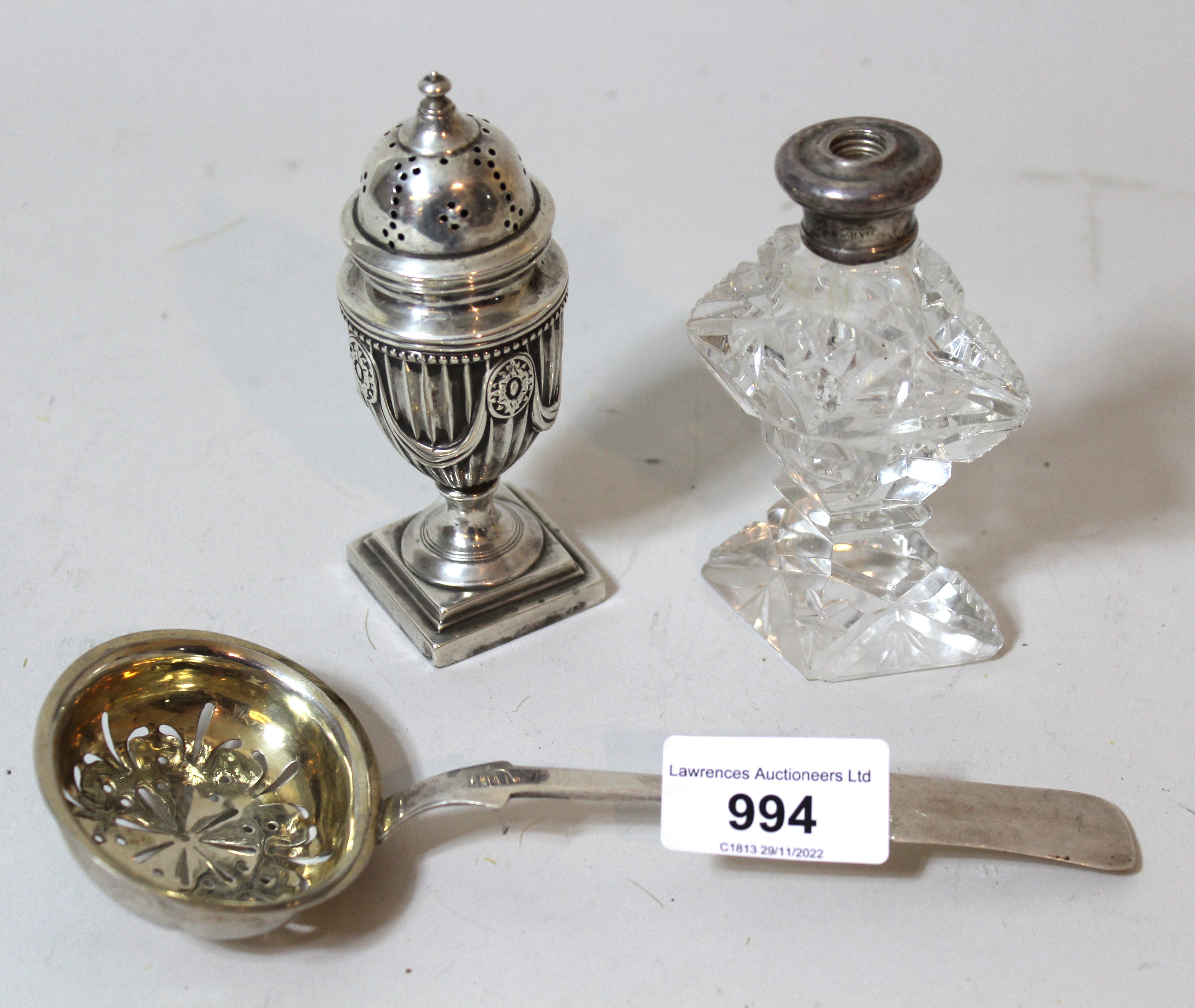 Victorian silver pedestal pepper, cut glass silver mounted perfume bottle (at fault) and a silver (