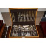 Silver plated canteen of cutlery in oak box, and a pair of Indian white metal vases