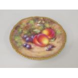 Small Royal Worcester porcelain side plate, painted with fruit and signed Freeman, 6ins diameter