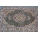 Small Indo Persian rug with a lobed medallion and all-over Herati design on a moss green ground with