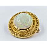 Victorian Etruscan revival opal brooch, the unmarked high carat gold mount of circular stylised