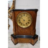 Continental walnut cased mantel clock having circular dial with two train movement striking on gongs