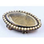 Georgian yellow metal blue enamel and split seed pearl set mourning brooch with double pin fastening