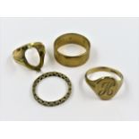 9ct Gold signet ring together with a 9ct gold wedding band an eternity ring and a gold ring mount (