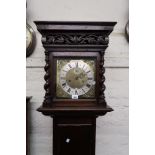 Oak longcase clock with a rectangular carved pierced and barley twist hood above a rectangular