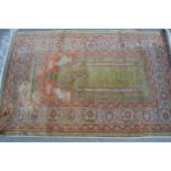Turkish part silk prayer rug, the centre panel with multiple borders, 55ins x 36ins Some minor