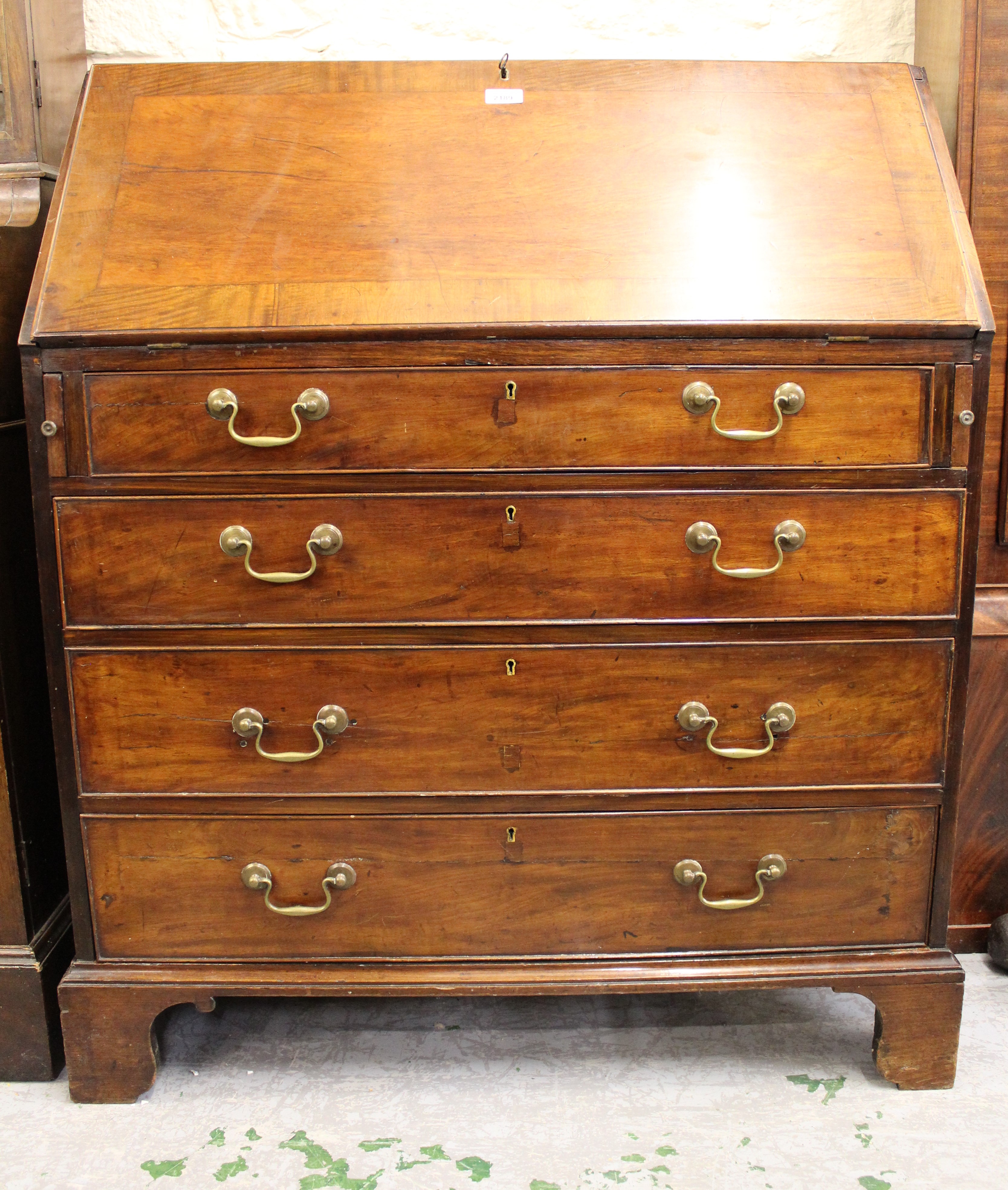 George III mahogany bureau, the fall front enclosing a fitted interior above four graduated