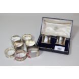 Pair of silver napkin rings in original box and seven other various silver napkin rings