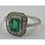 Platinum ring set with central octagonal emerald surrounded by diamonds, size N 2.9g Dimensions of