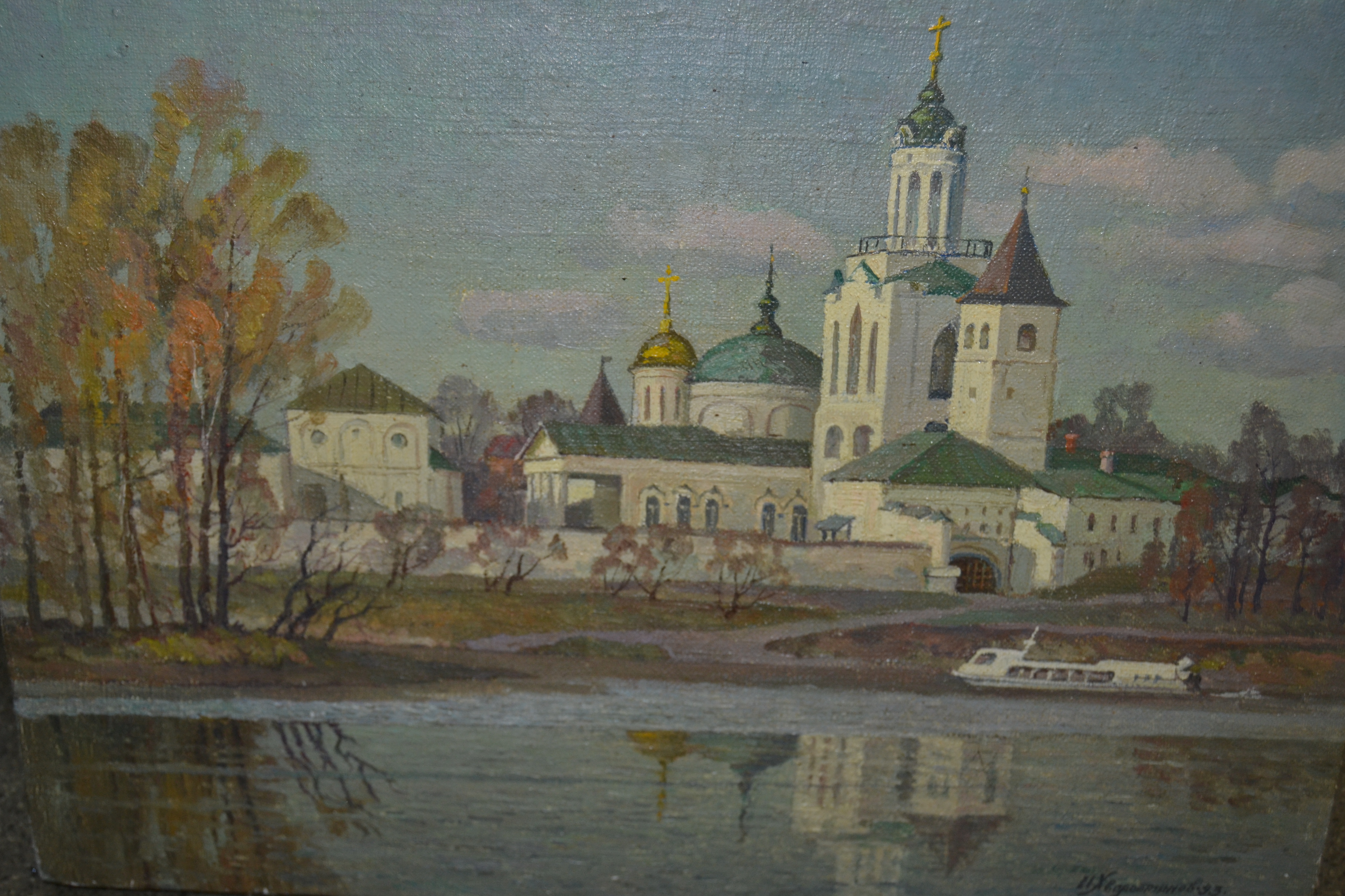 Russian school oil on canvas, river landscape with church, signed indistinctly, 12.5ins x 18ins,