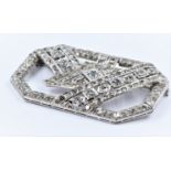 Large Art Deco style high carat white metal and diamond set brooch of irregular octagonal form,