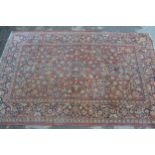 Tabriz rug with a medallion and all-over floral design on a red ground with borders, 6ft 8ins x