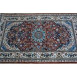 Small modern Persian silk rug with a lobed medallion and all-over stylised floral design on a rust