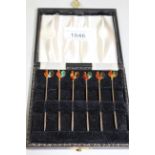 Set of six silver and enamel cocktail sticks in the form of cockerels, in original box Does have