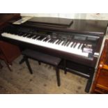 Yamaha Clavinova numbered CVP-103 in a simutated wood case with matching stool including booklet and