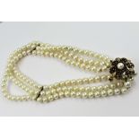 Triple row uniform cultured pearl choker with 9ct gold garnet and cultured pearl set clasp with