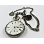 Continental sterling silver cased keywind open face pocket watch, suspended from a silver Albert