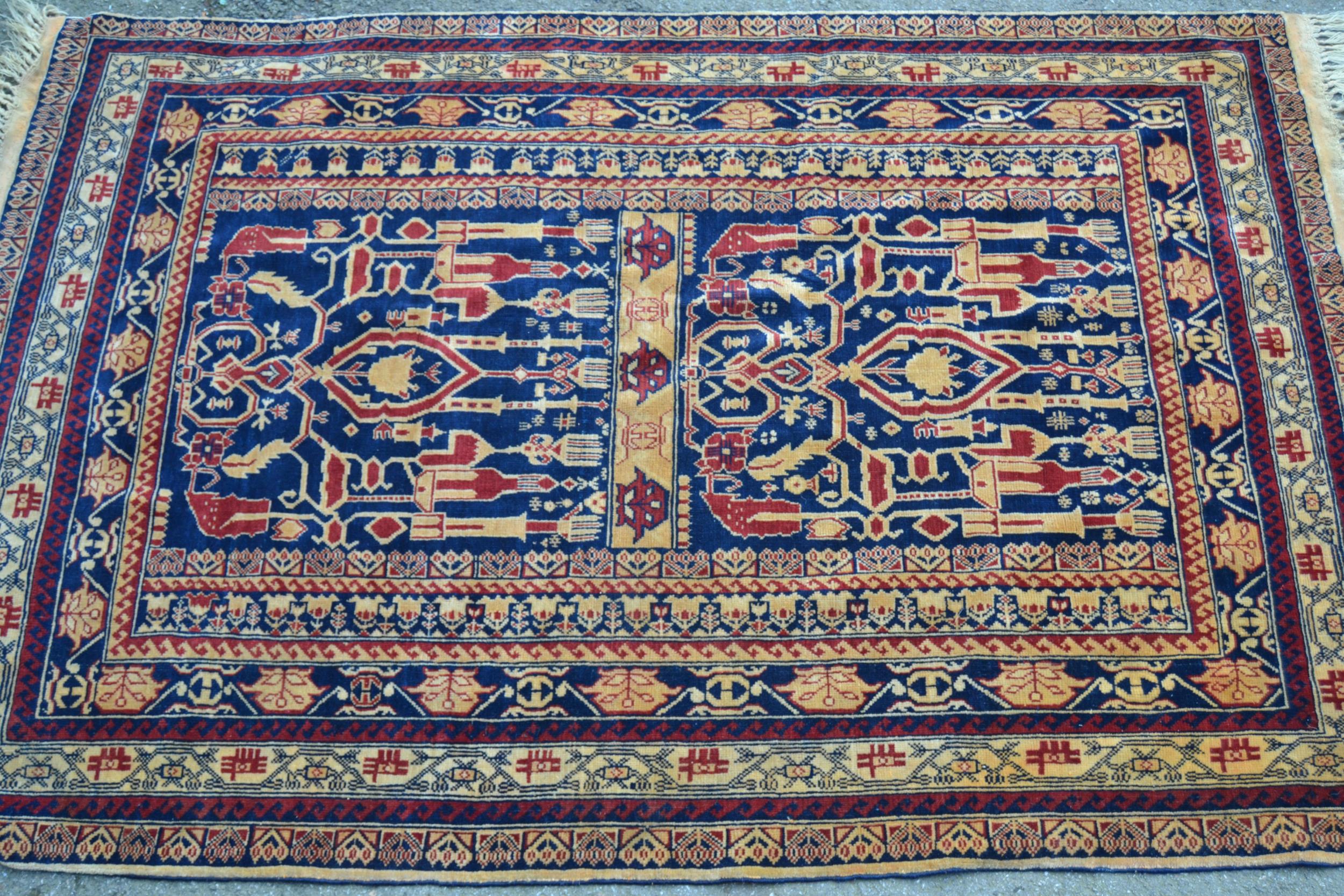 Two modern Afghan Belouch rugs on gold ground, each approximately 5ft x 3ft