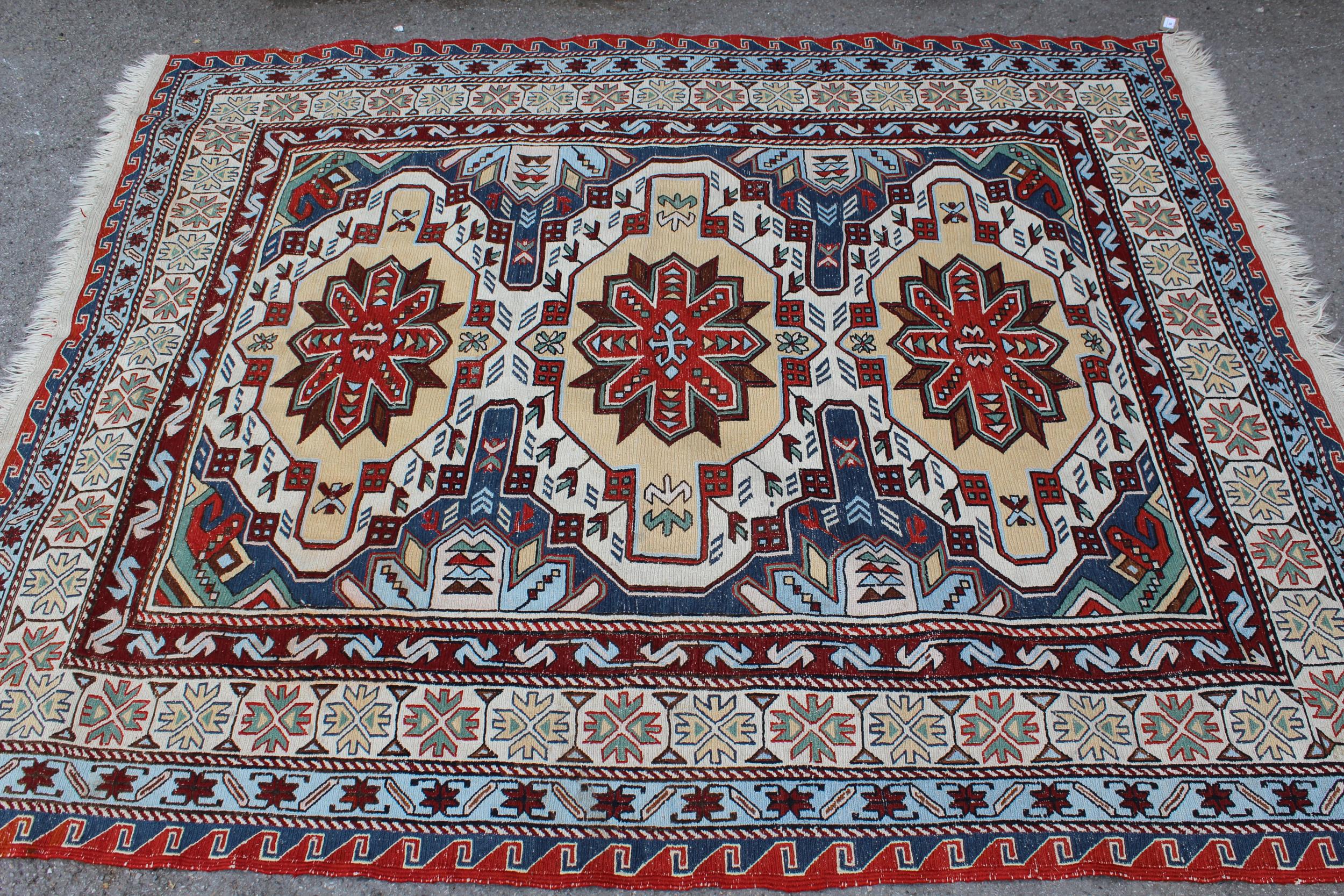 Caucasian flatweave rug of Soumak type, with a triple medallion design in shades of red, yellow